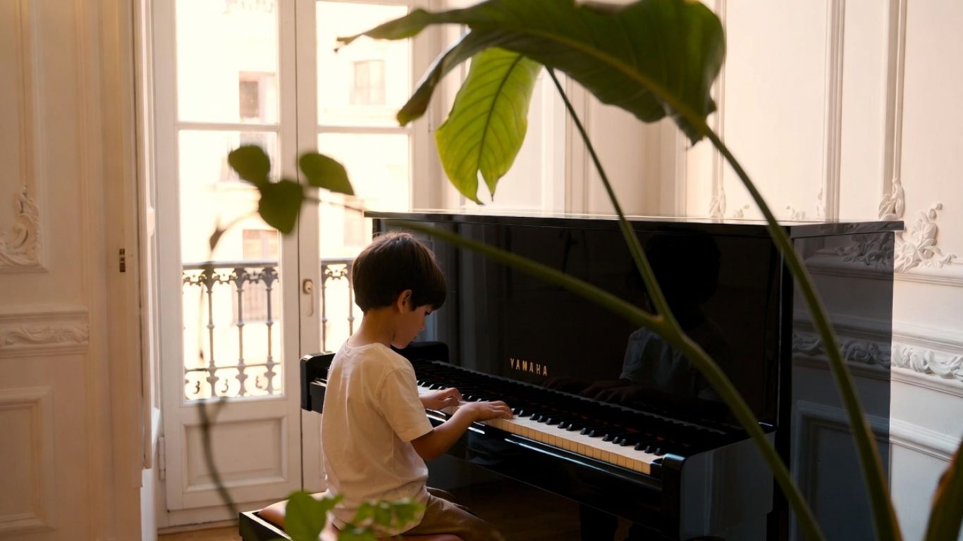 Child playing Yamaha piano
