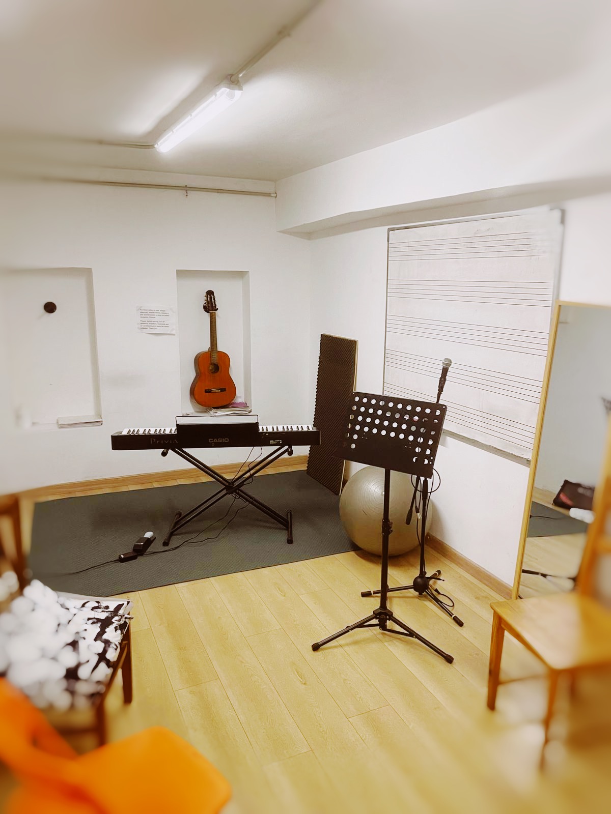 Music studio with piano and guitars
